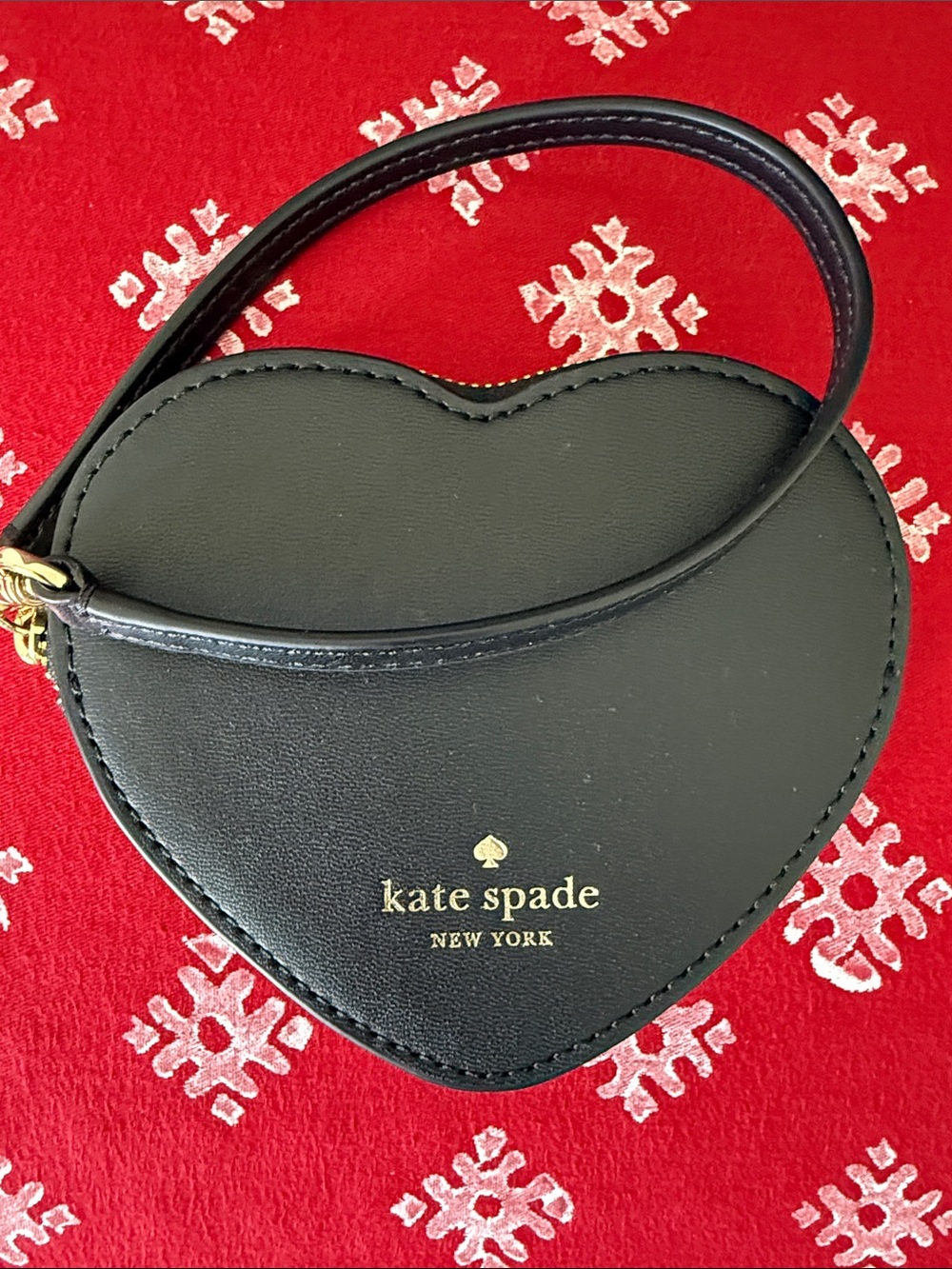 kate spade black heart wristlet with gold logo